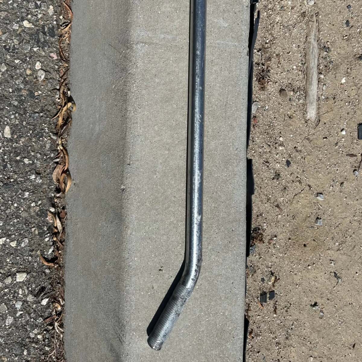 A metal bar that fell from a truck and pierced a van's windshield.