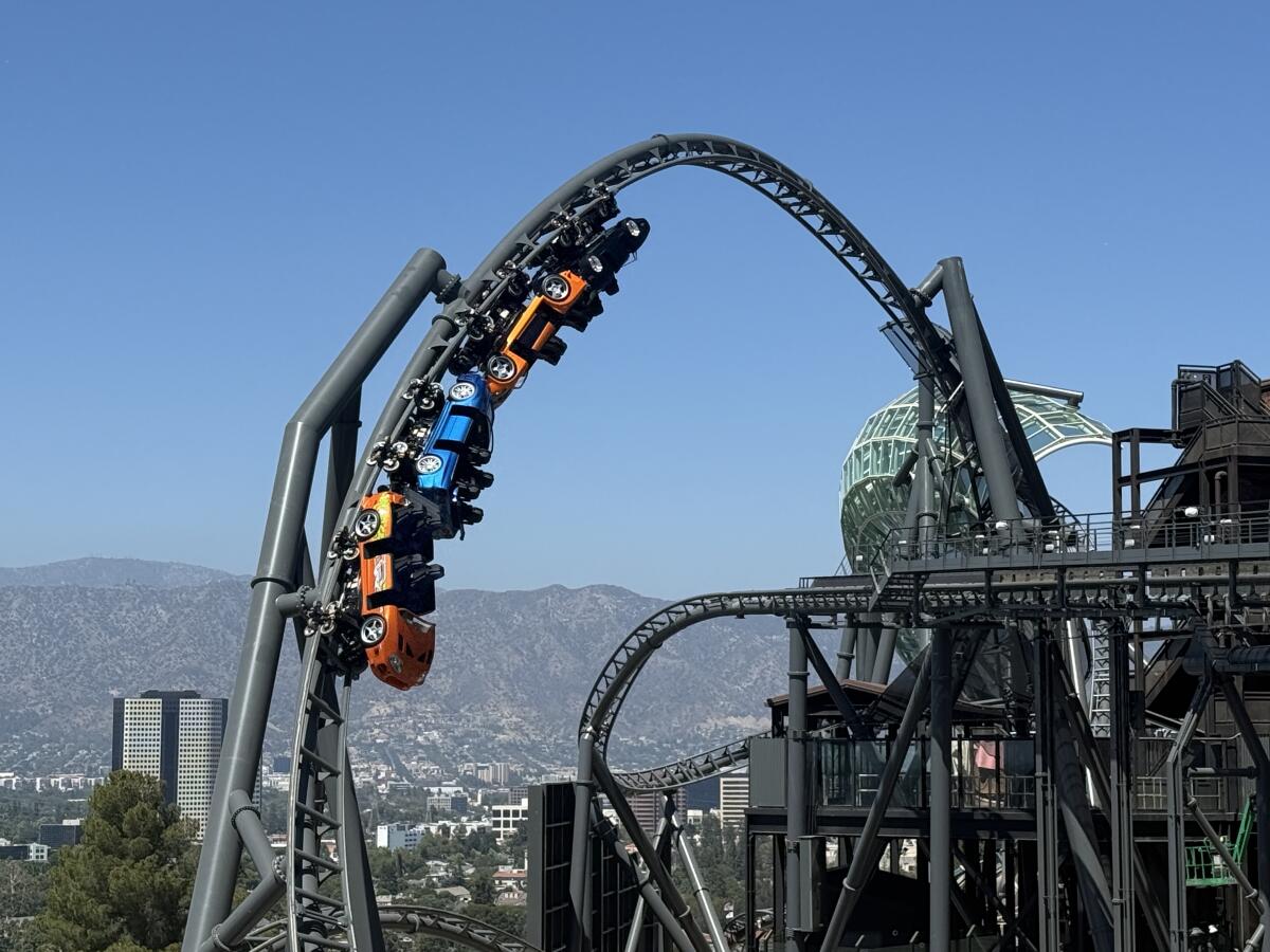 Coaster cars coming down from a loop.