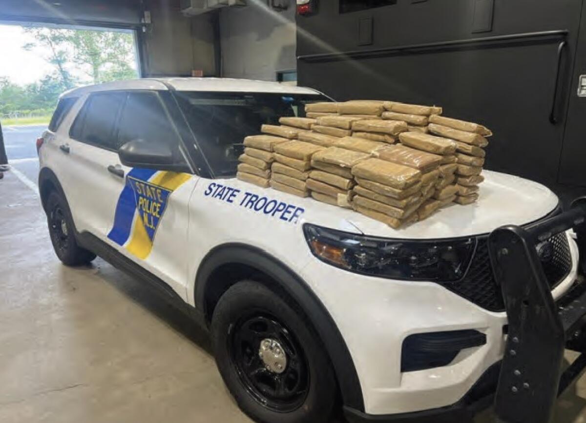 Cocaine and heroin on a state trooper vehicle hood