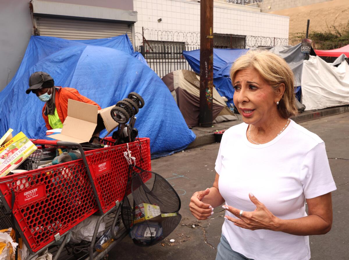 Estela Lopez walks through Skid Row