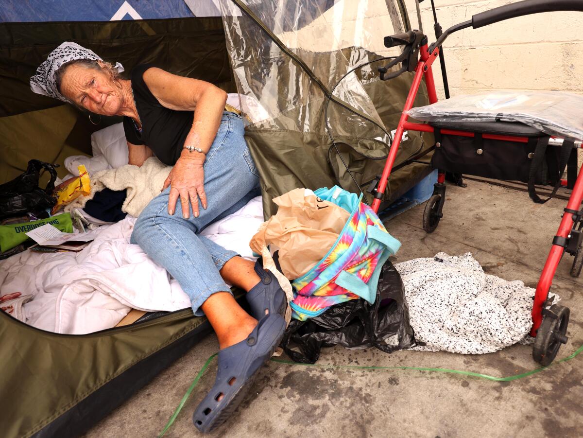 Judy Mauricio, 65, rests inside her ten.