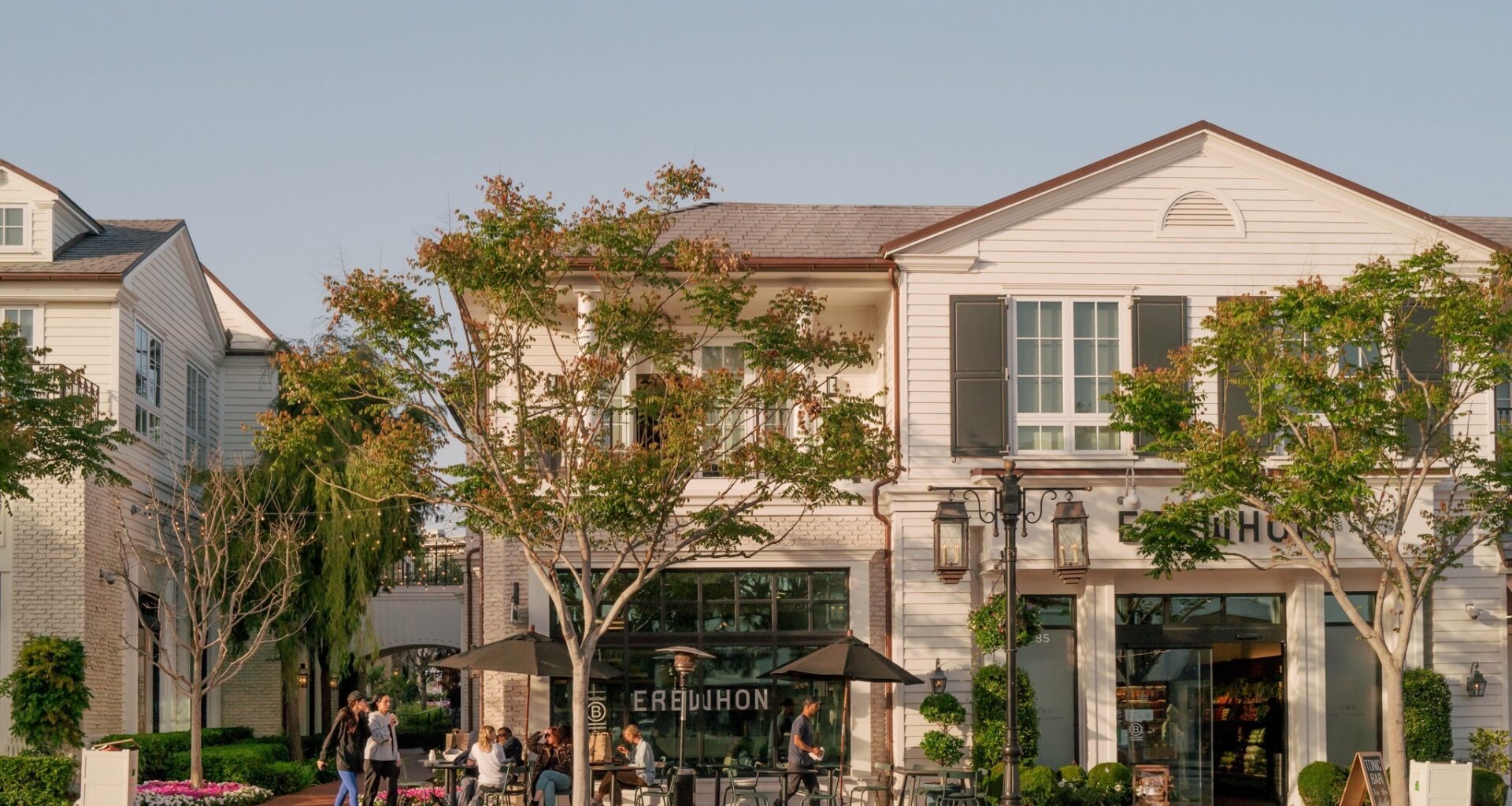 Palisades Village, one of the few retail blocks to survive the Palisades Fire, will reopen this August