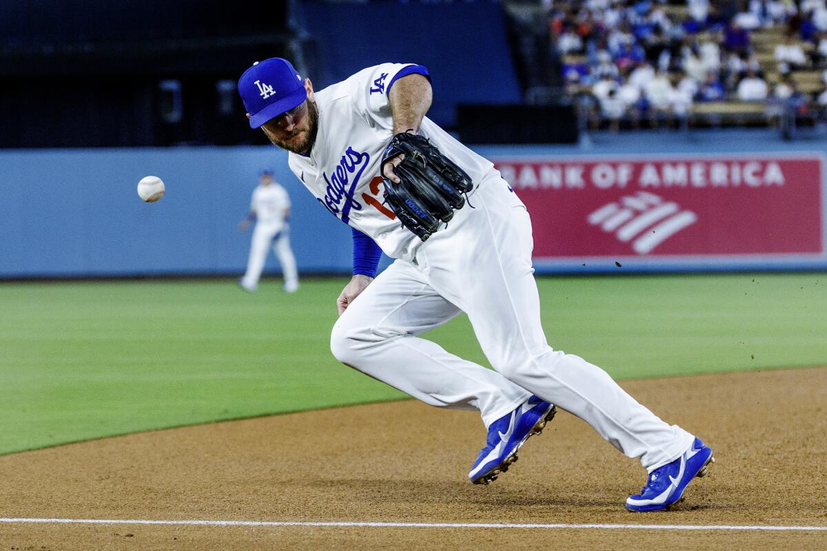 Third baseman Max Muncy can't get his glove on a line-drive double by Kyle Karros in the fourth inning.