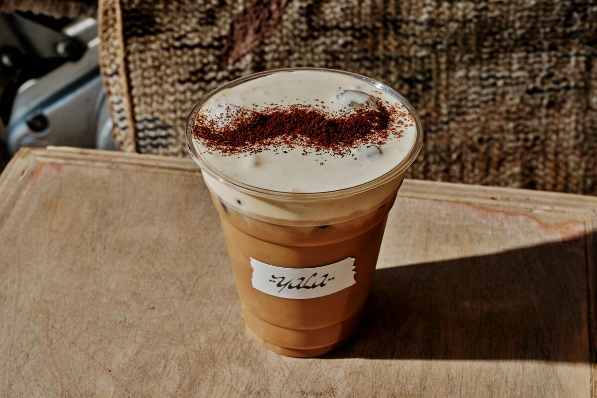 A latte made with cardamom-spiced cream top