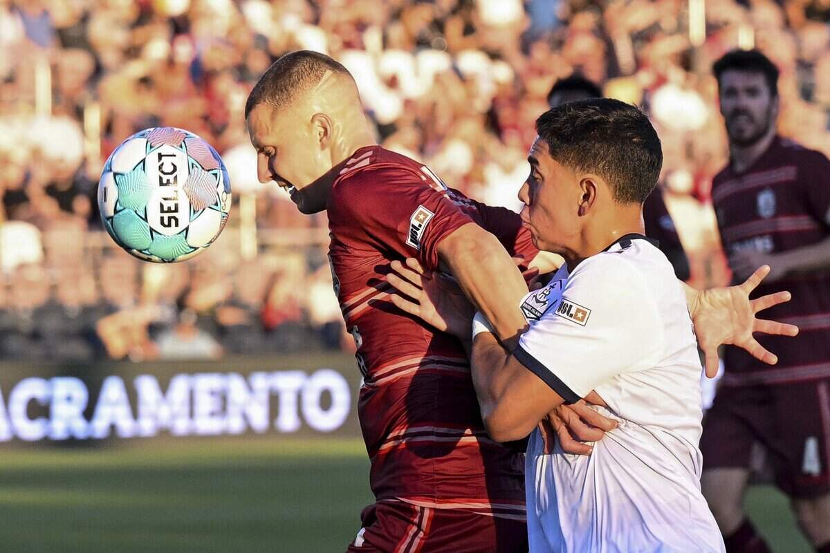 Republic FC defender Jack Gurr, left, and Rhode Island FC defender Aldair Sanchez race for the ball during a match in Sacramento on Wednesday. Republic FC defeated Rhode Island FC, 2-1.