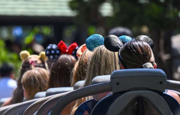Visitors to Matterhorn Bobsleds wear Mickey ears inside Disneyland at the Disneyland Resort in Anaheim, CA, in 2024. (Photo by Jeff Gritchen, Orange County Register/SCNG)