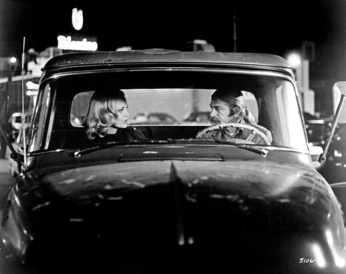 Two people bicker in a car.