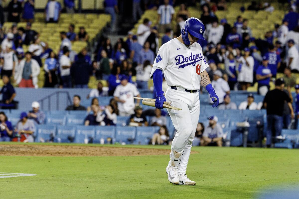 Dalton Rushing walks back to the dugout after grounding out to end the game in the Dodgers' 9-3 loss.