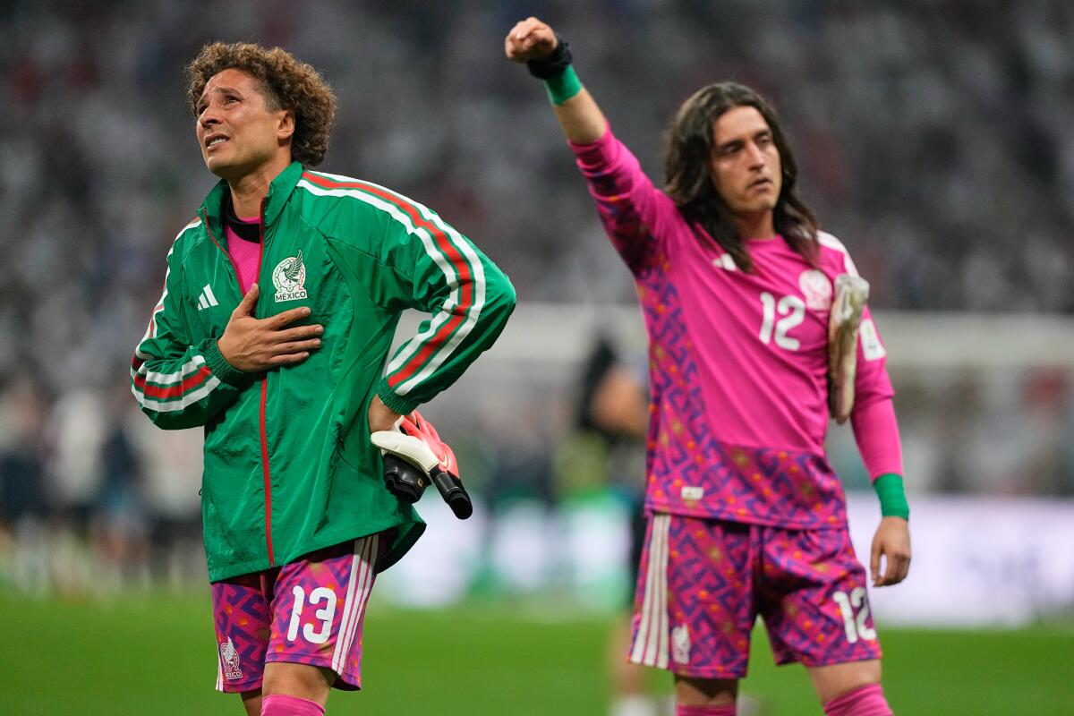 Mexican players react following their World Cup round of 16 soccer match against England in Mexico City.