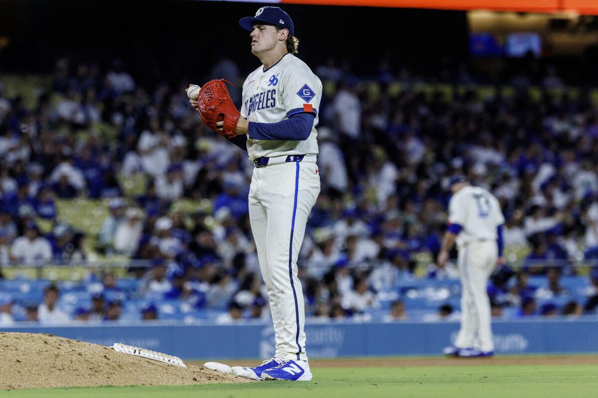 Dodgers relief pitcher Landon Knack reacts after giving up a solo homer.