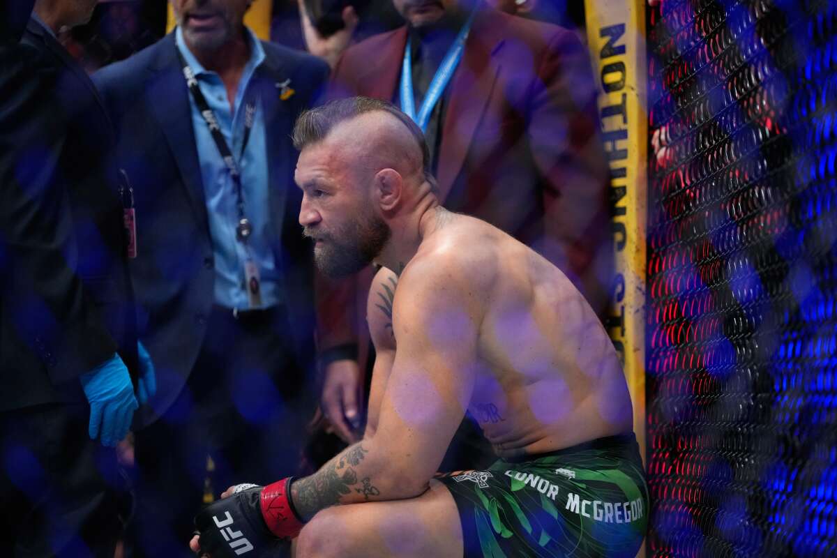 Conor McGregor reacts after losing to Max Holloway in a welterweight fight at UFC 329 on Saturday.