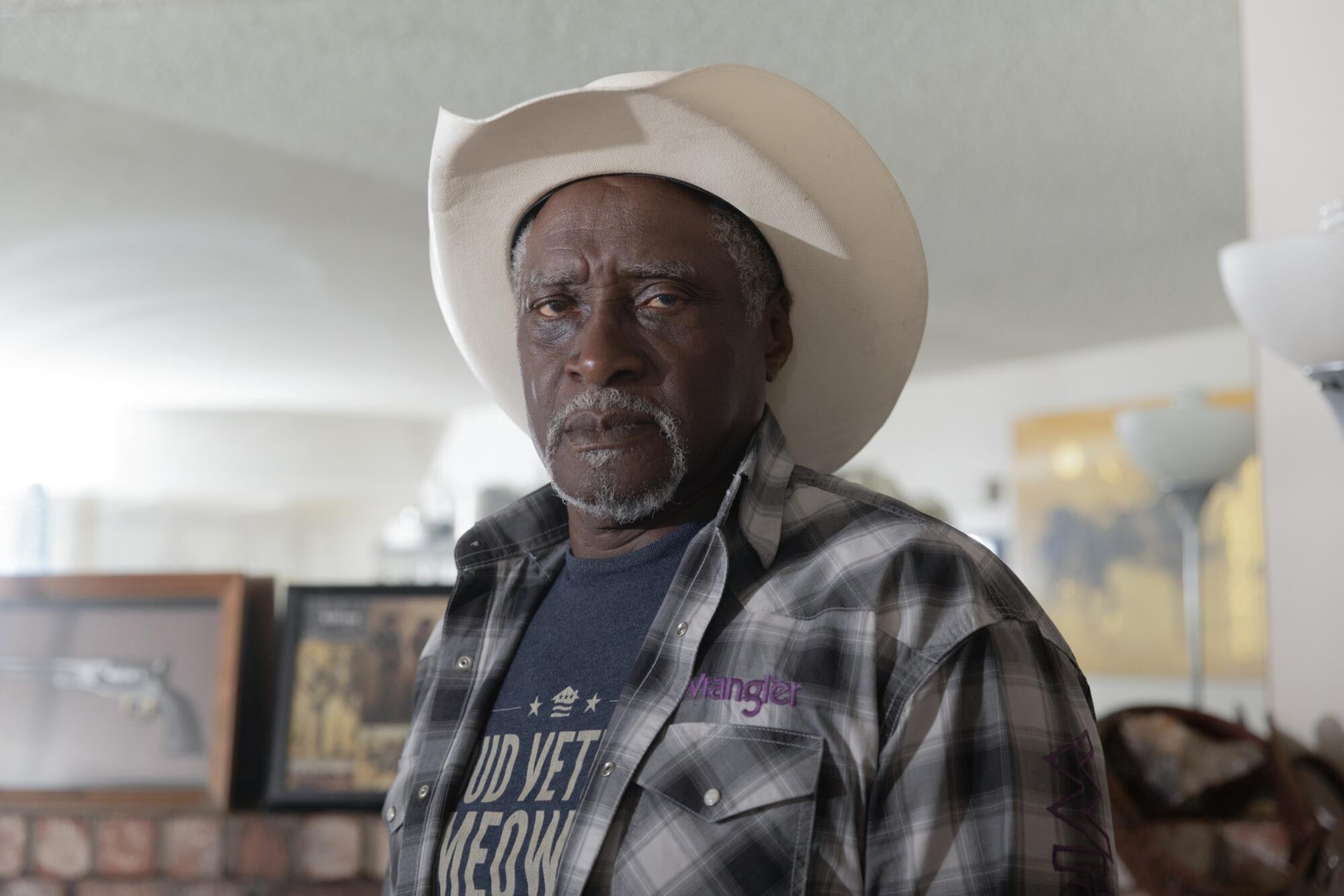a man stands for a portraits inside his home in Las Vegas, Nevada on May 22, 2026.