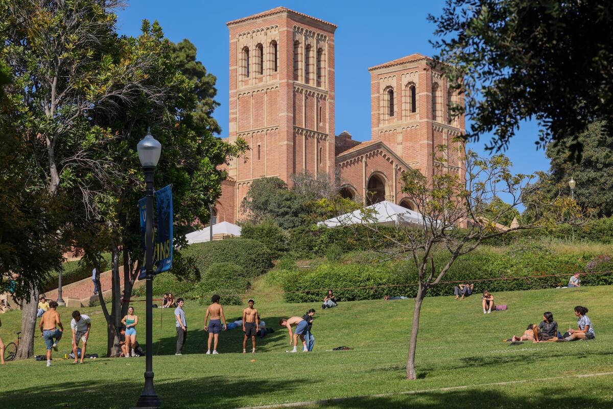 Students congregate at the grassy area near the Janss Steps on the UCLA campus.