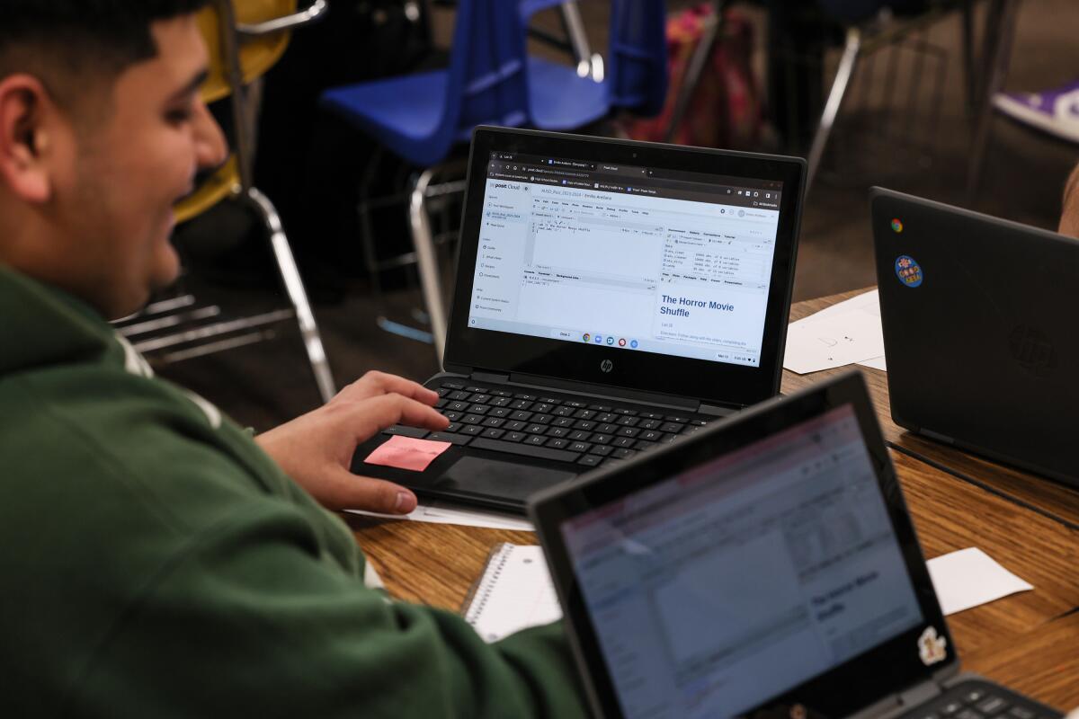 A student with a laptop in a data science class at San Gabriel High School.