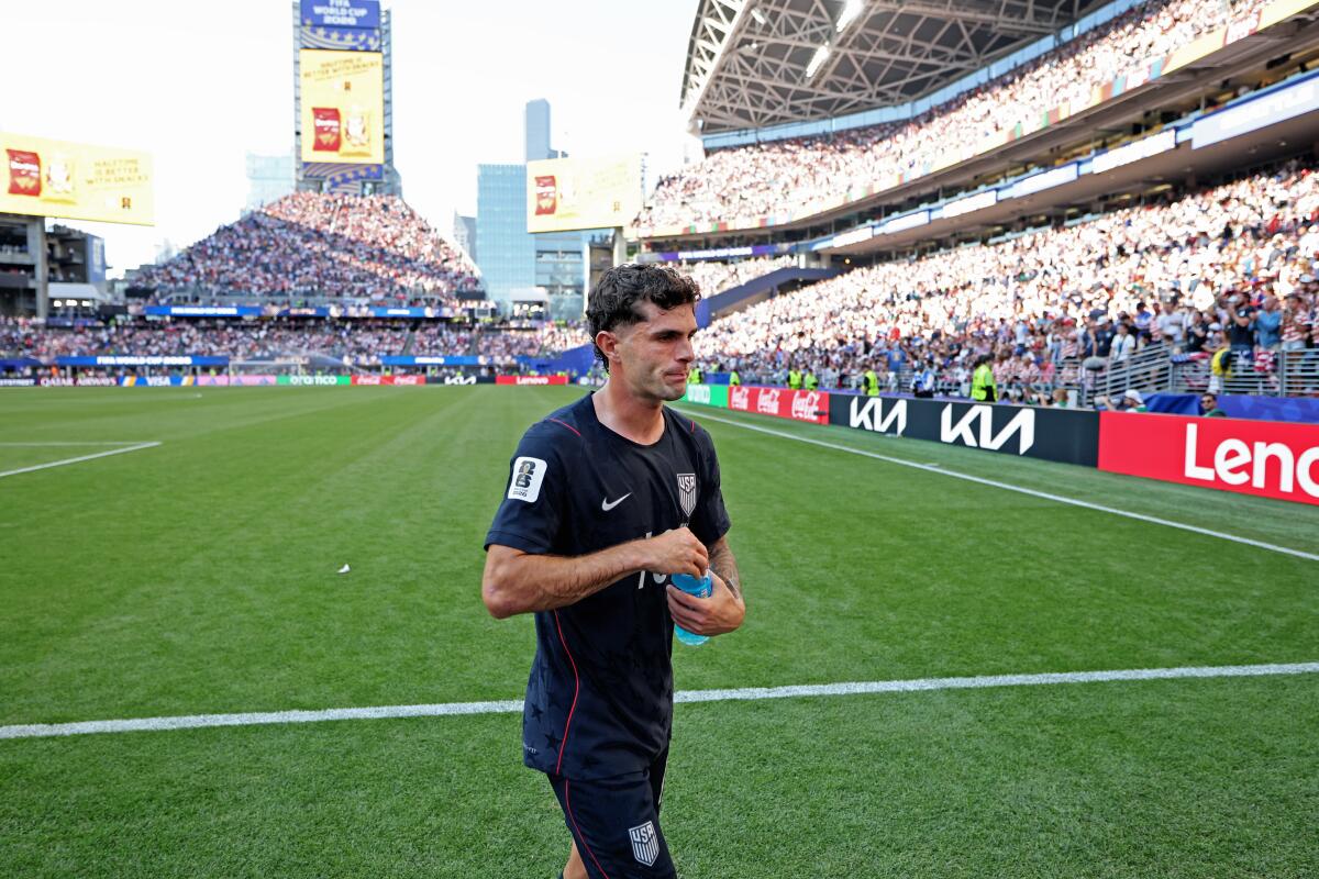 U.S. forward Christian Pulisic heads to the locker room at halftime during the loss to Belgium.