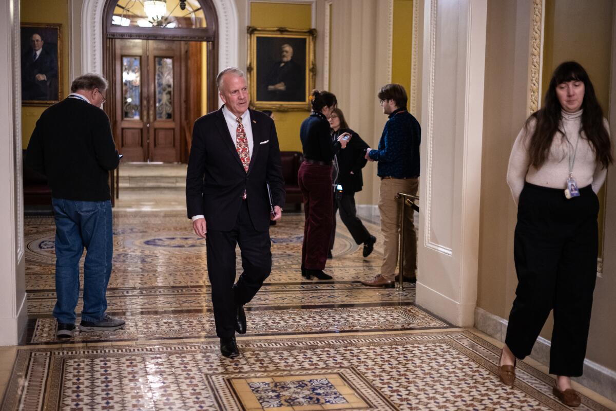 Sen. Dan Sullivan (R-Alaska) attends meetings at the U.S. Capitol in 2025.