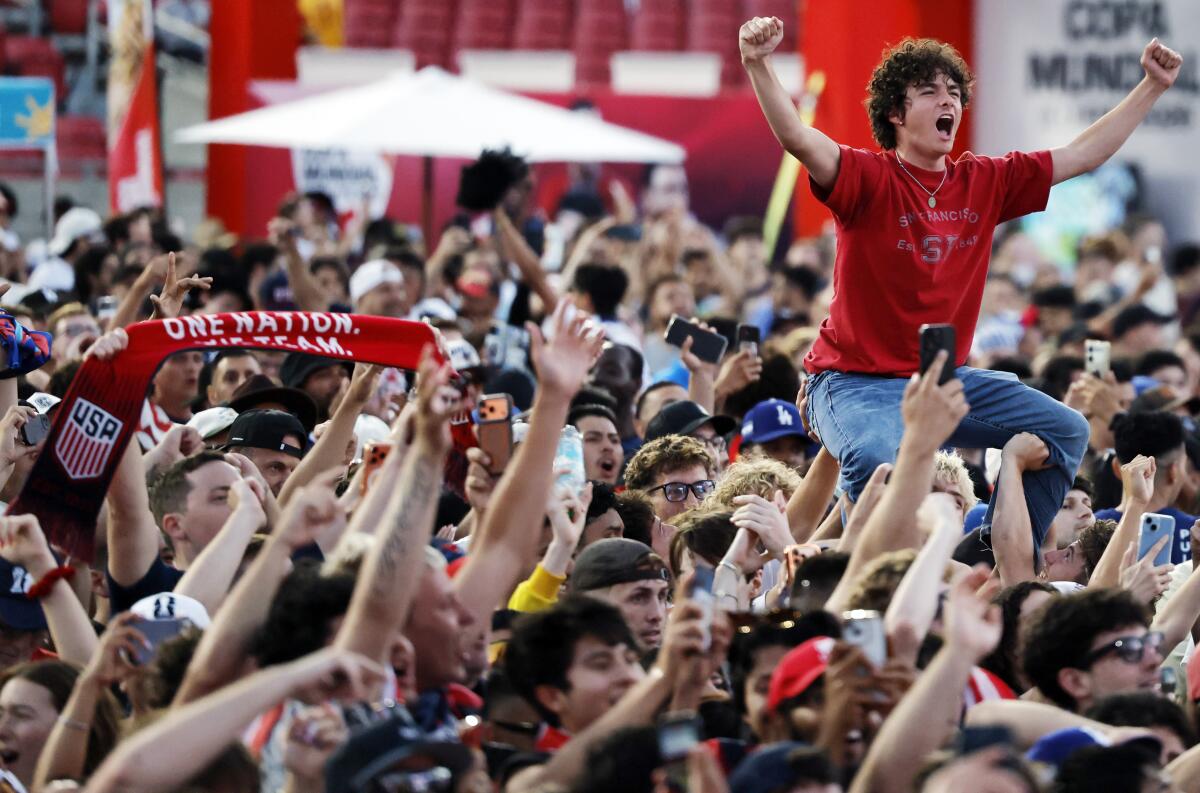 U.S. fans celebrate during a watch part at the Coliseum during the Americans' win over Paraguay on Friday.