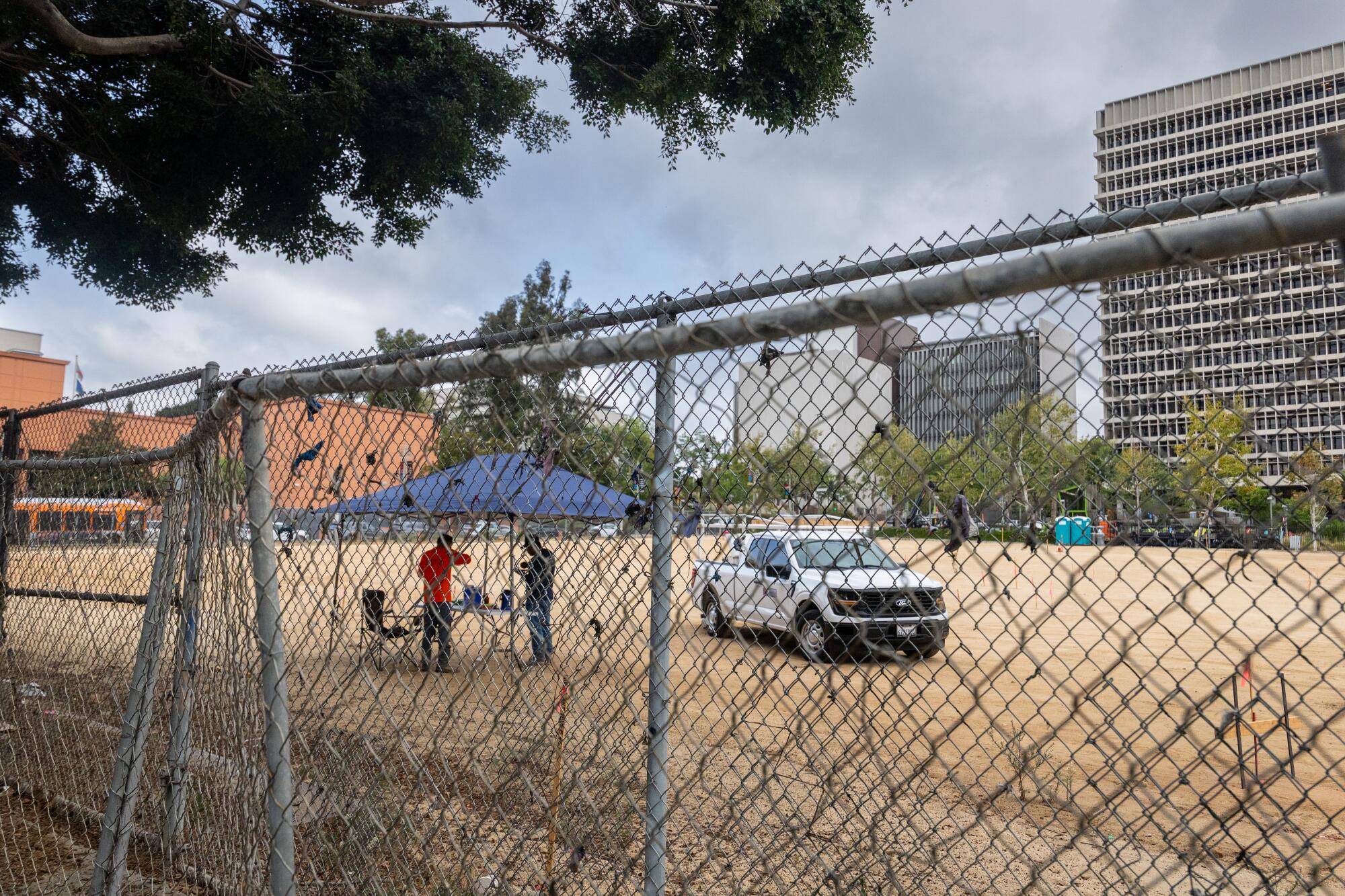 Construction workers being work on a temporary Chicano and Mexican Art Museum.