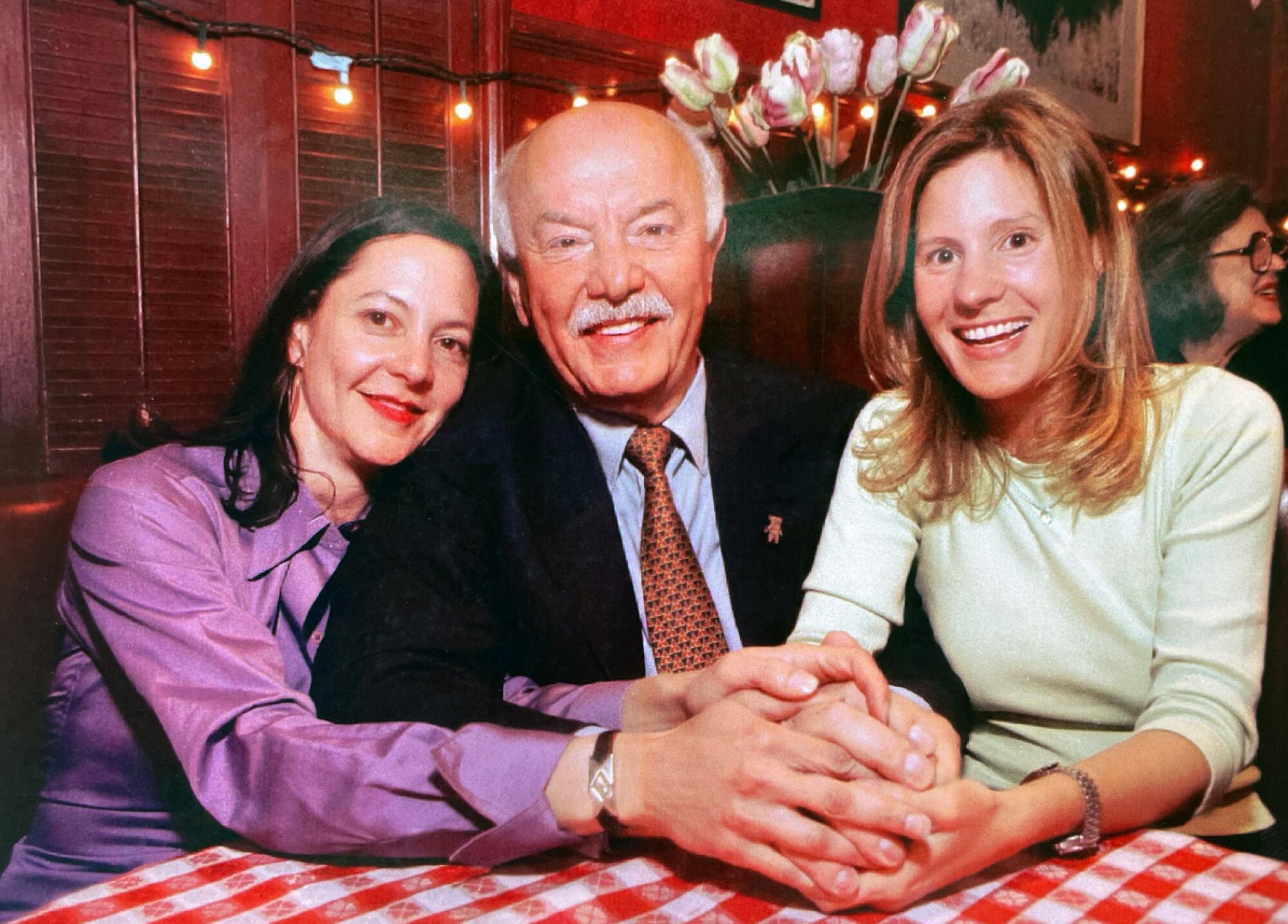 Gabrielle and Katerina Tana with their dad at Dan Tana's.