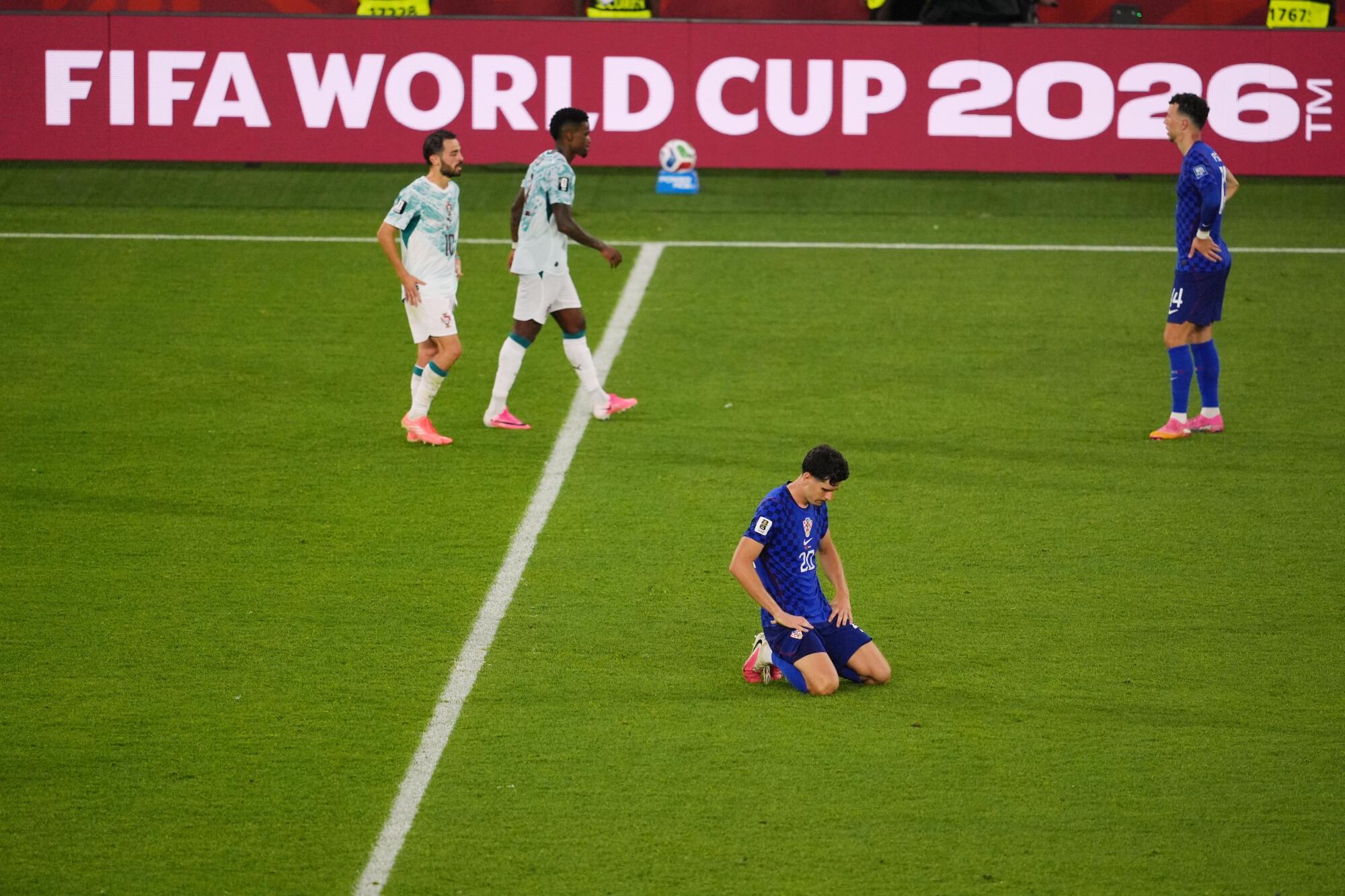 Croatia's Igor Matanovic kneels after his team lost to Portugal and was eliminated from the World Cup on July 2.