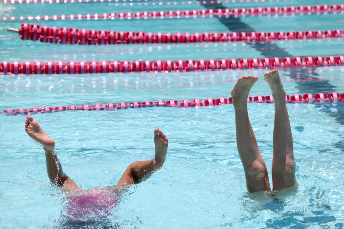 As weather heats ups children cool down during Camp Anderson at the Rose Bowl Aquatics Center in Pasadena 