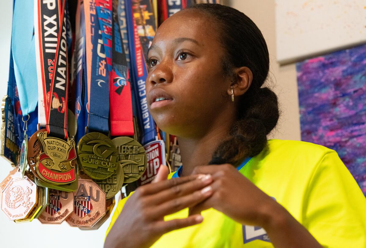 Fifi Garcia, 14, pictured with some of her medals in her Huntington Beach home.