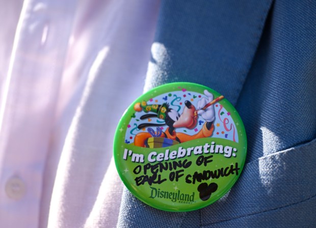 Luke Montagu, 12th Earl of Sandwich, center, wears a pin during a celebration for the opening of Earl of Sandwhich at Downtown Disney in Anaheim, CA, on Wednesday, July 15, 2026. (Photo by Jeff Gritchen, Orange County Register/SCNG)