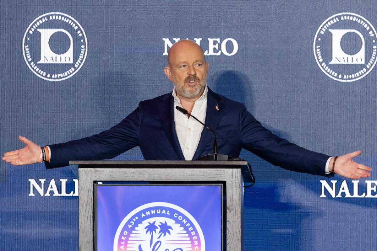 California gubernatorial candidate Steve Hilton speaks at a lectern.