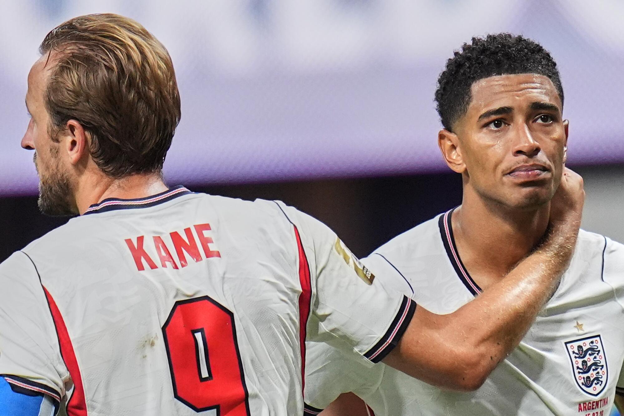 England's Harry Kane and England's Jude Bellingham are dejected after losing to Argentina during a World Cup semifinal.
