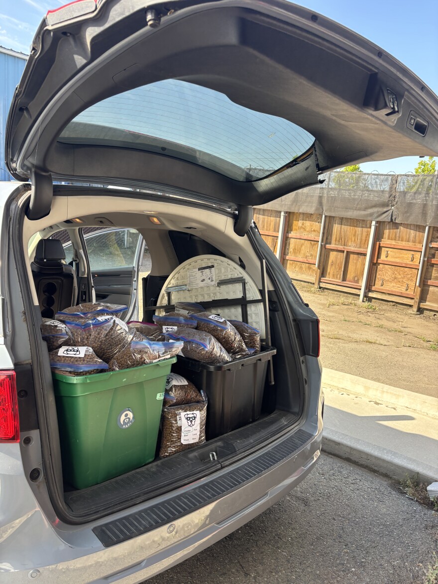 Meg and her team will distribute over 300 pounds of kibble before their day of outreach is done.