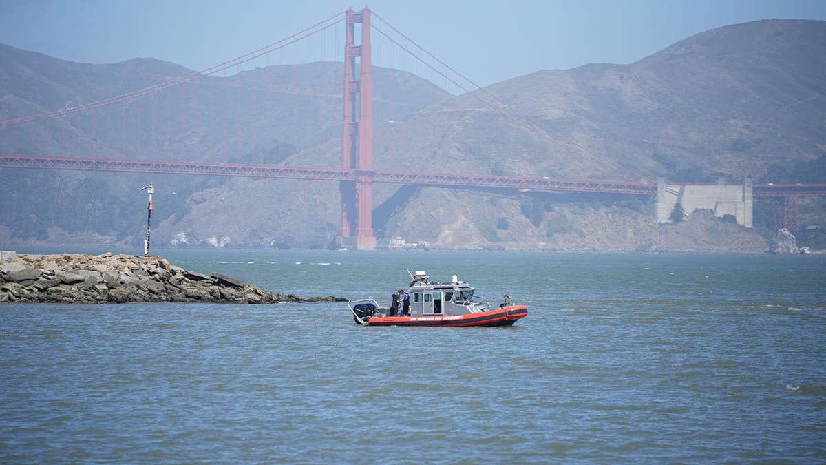San Francisco Fire Department and Coast Guard crews search San Francisco Bay near Alcatraz after boat capsize