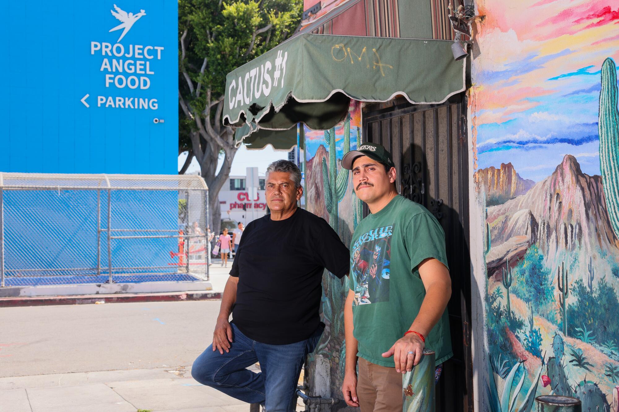 Mario Tornel, left, and his son Marlo Tornel stand outside of Cactus Taqueria no. 1