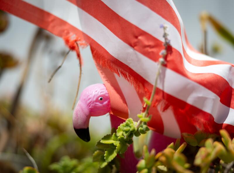 A decorative flamingo and American flag are viewed at Flamingo Garden Mobile Home Park on July 9. Mobile home parks in Carson are among the last refuges of affordable housing for many residents.