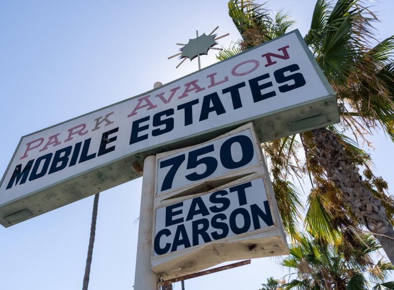 a sign reads Park Avalon Mobile Estates 750 East Carson