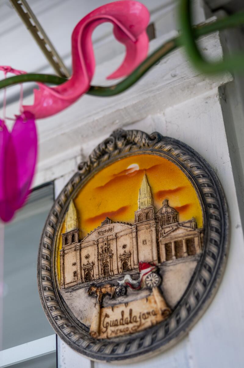 A flamingo and Guadalajara, Mexico sign are viewed at the entrance of the mobile home