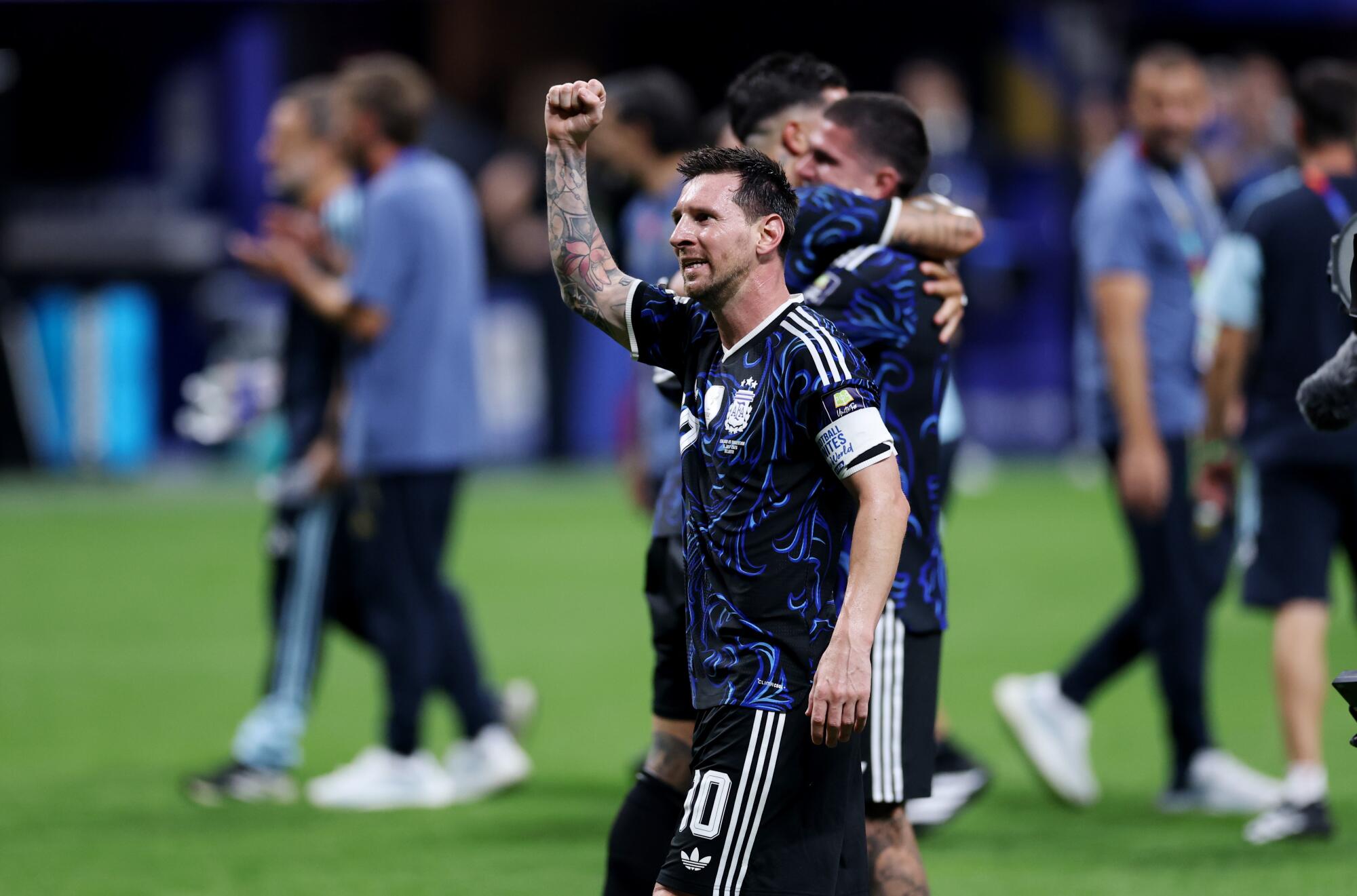 Argentina star Lionel Messi celebrates after a win over England in the World Cup semifinals on Wednesday.