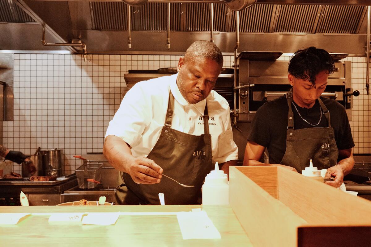 Chef-owner Keith Corbin with a cook in the kitchen of Alta