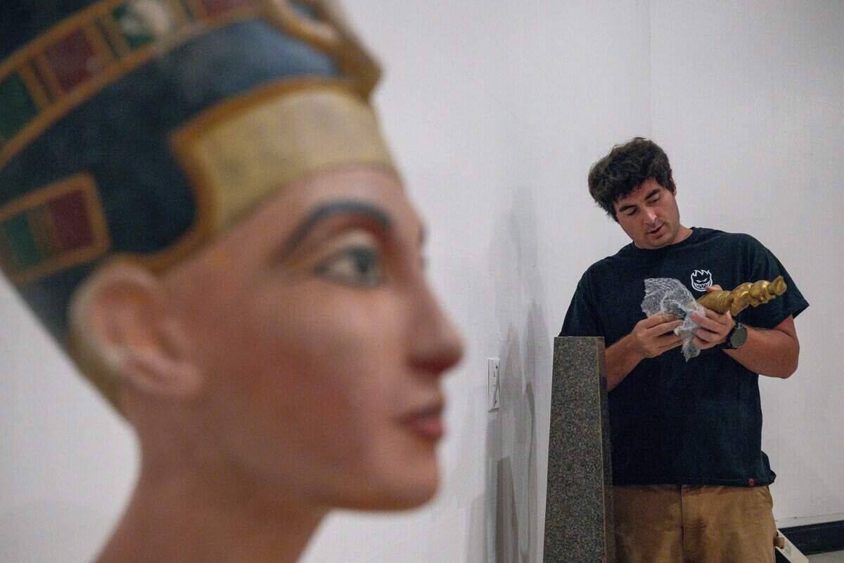Exhibit Technician Austin Clarks checks the King Tut replica during the California State Fair media day at Cal Expo in Sacramento on Wednesday.