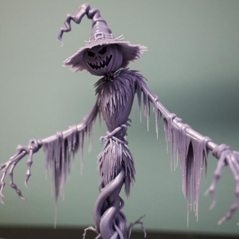 A sculpture resembling a witch, scarecrow and  skeleton with spiral features  