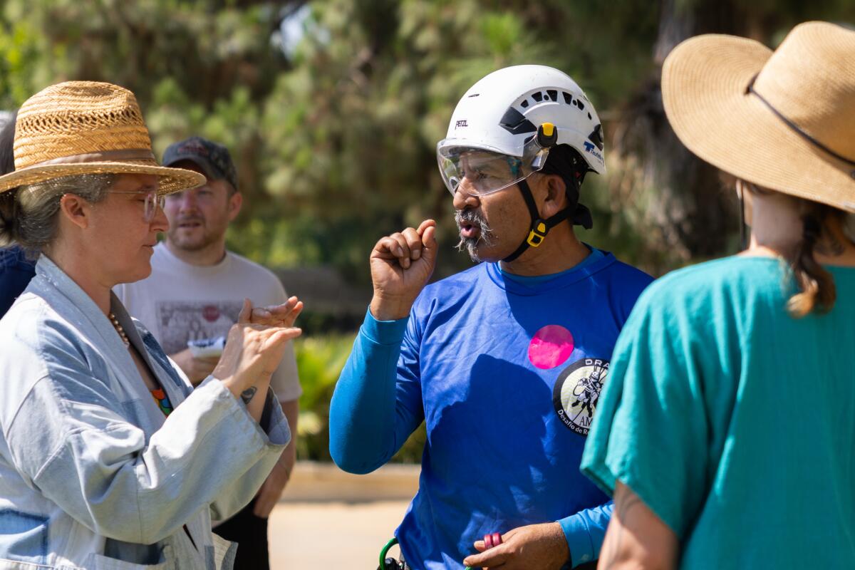 Humberto Mojica speaks to people at a community event