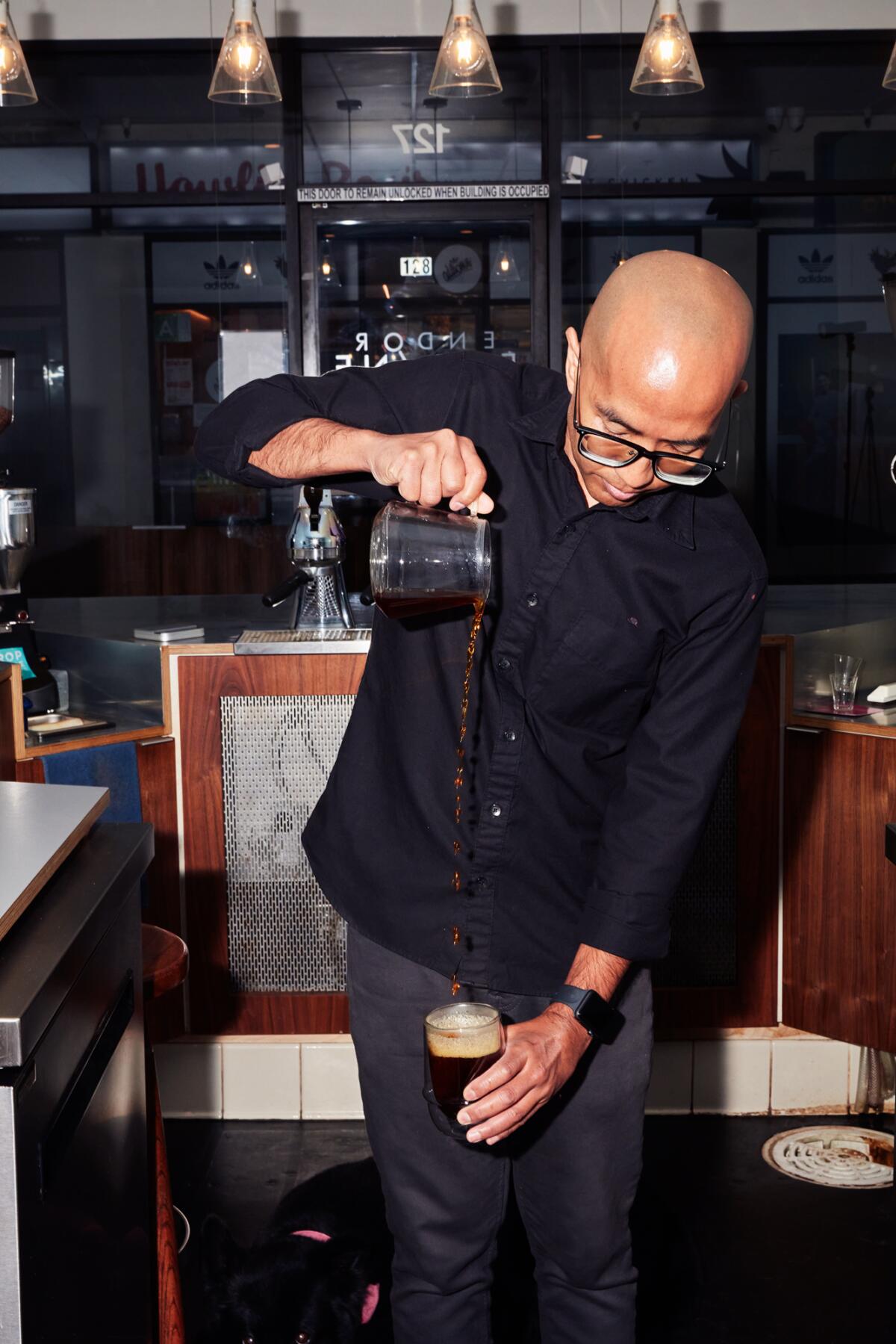 Jack Benchakul, owner of Endorffeine in LA's Chinatown, finishing a pour-over.