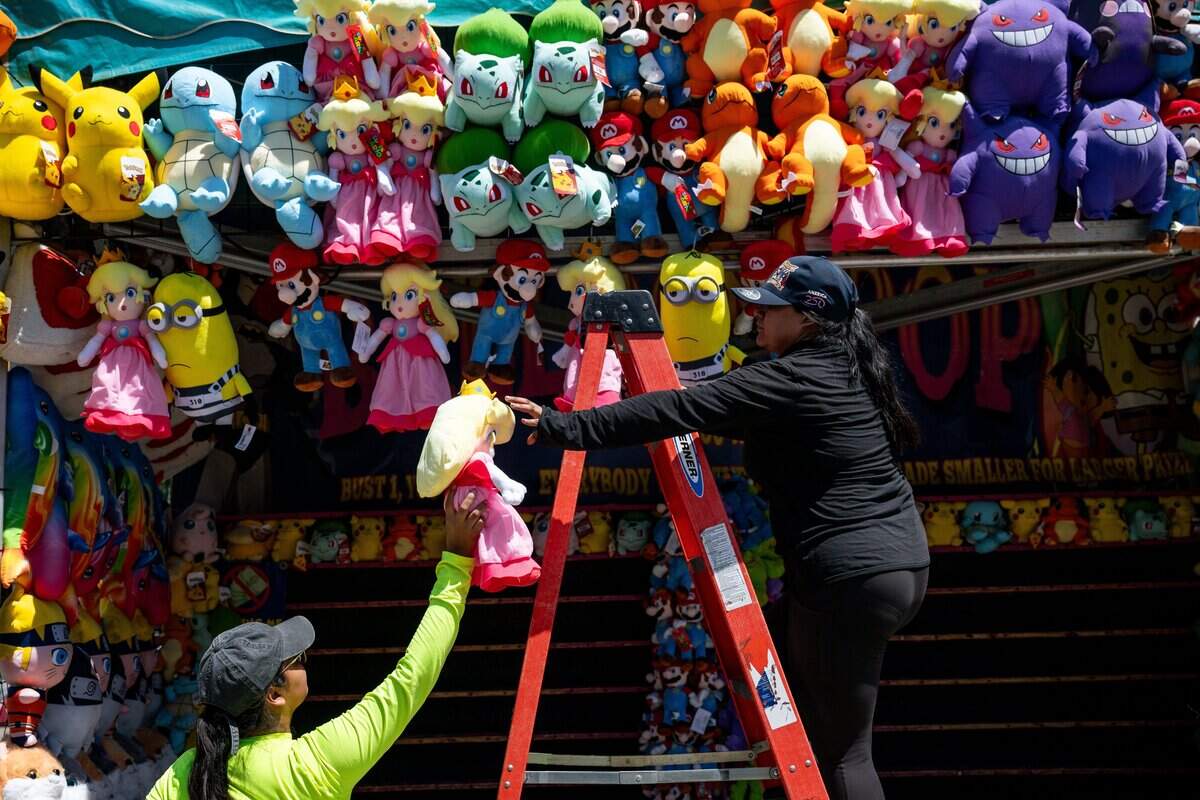 Workers prepare for the opening of the California State Fair at Cal Expo in Sacramento on Wednesday. The fair opened to the public on Friday.