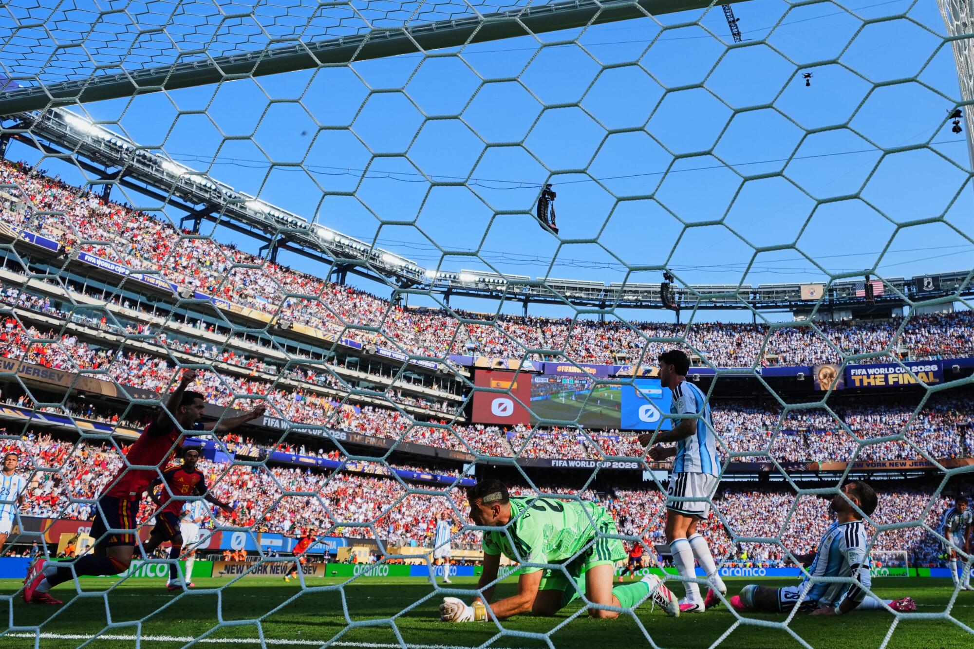 Argentina goalkeeper Emiliano Martínez reacts as Spain's Ferran Torres scores during the World Cup final.