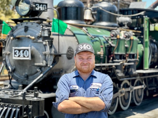 Knott's Berry Farm engineer, fireman and mechanic Jacob Kern in front of Locomotive 340. (Photo by Brady MacDonald, Orange County Register/SCNG)