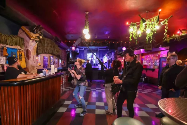A film crew consisting of Sherri Kauk, center, Emily Martinez Robles, and Thayer Walker document the interior of the Bottom of the Hill music venue in San Francisco, Calif., on Thursday, June 18, 2026. Filmmakers Chris Boone and Kevin Smokler are producing a documentary film about the legendary independent San Francisco club that is closing at the end of the year. (Ray Chavez/Bay Area News Group)