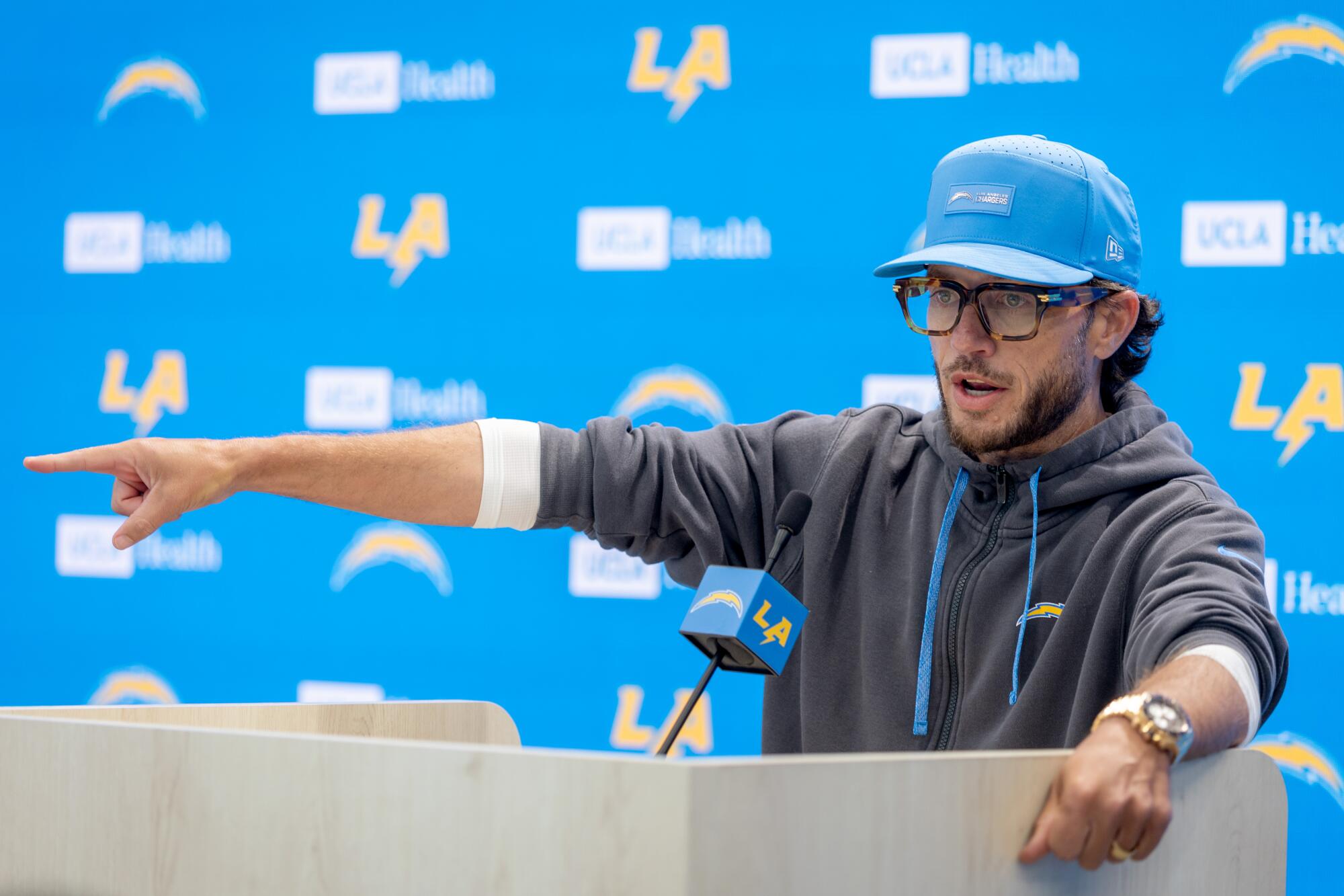 Chargers offensive coordinator Mike McDaniel speaks at a news conference on June 17.