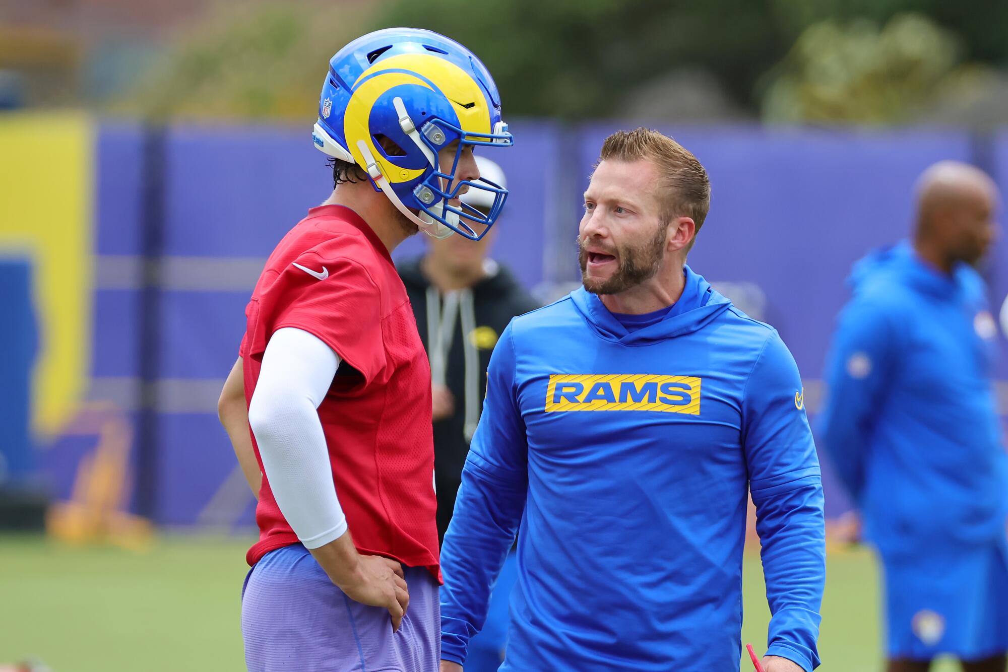 Rams quarterback Matthew Stafford speaks with coach Sean McVay during an organized team activities workout in May.