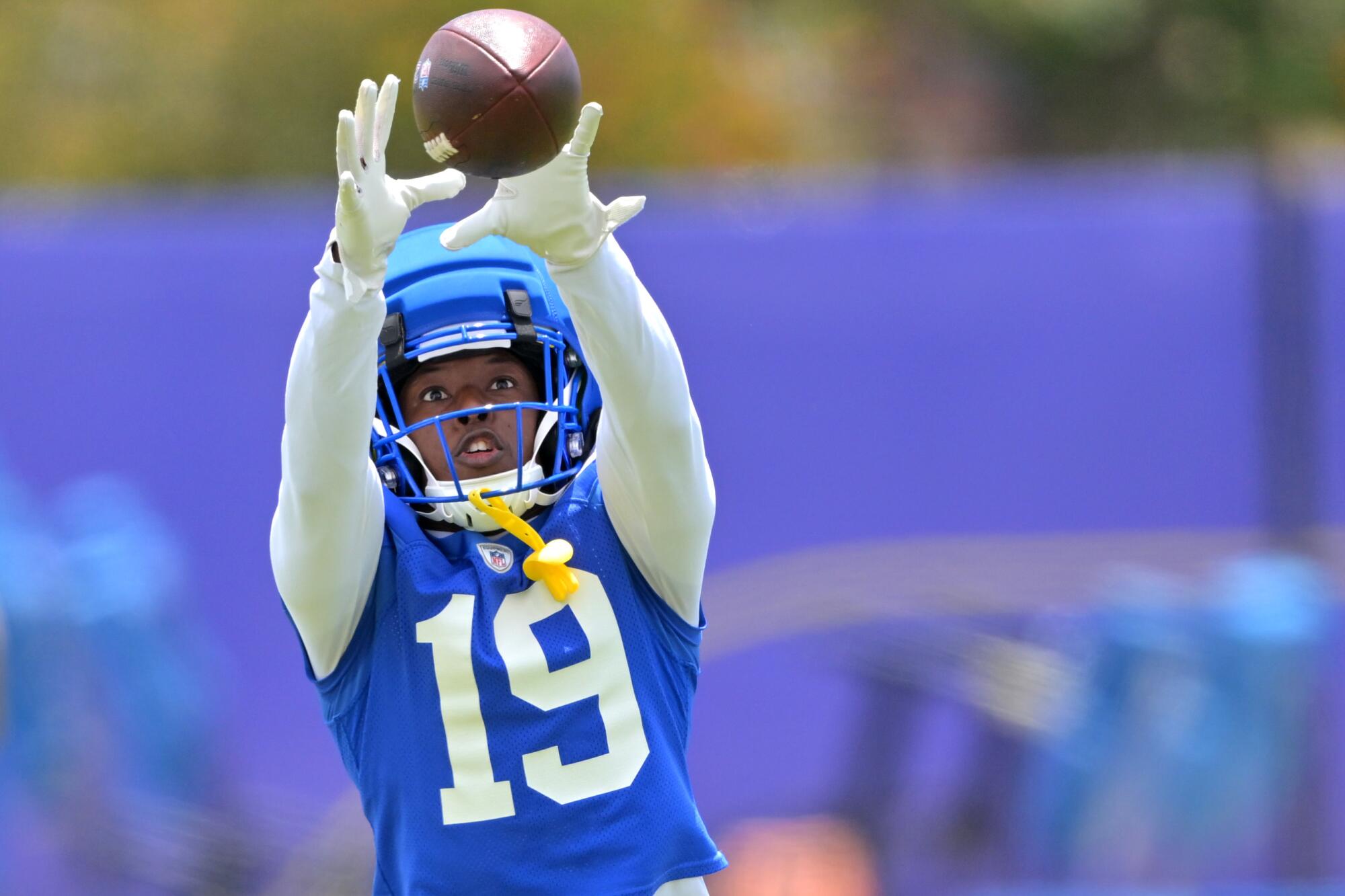 Rams wide receiver Xavier Smith catches a pass in practice in May.