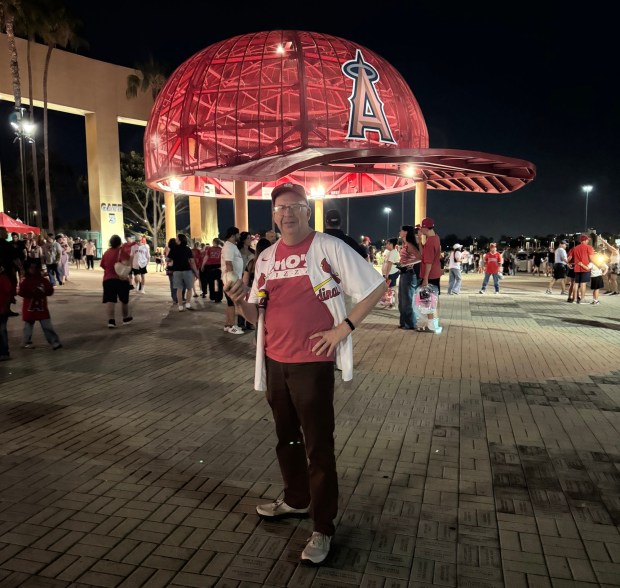 Columnist David Allen, who came to Tuesday's game at Angel Stadium in a Cardinals jersey and cap and a T-shirt from a St. Louis pizza chain, gamely smiles despite suffering through a 5-1 loss. (Photo by Madison Hart, Press-Enterprise/SCNG)