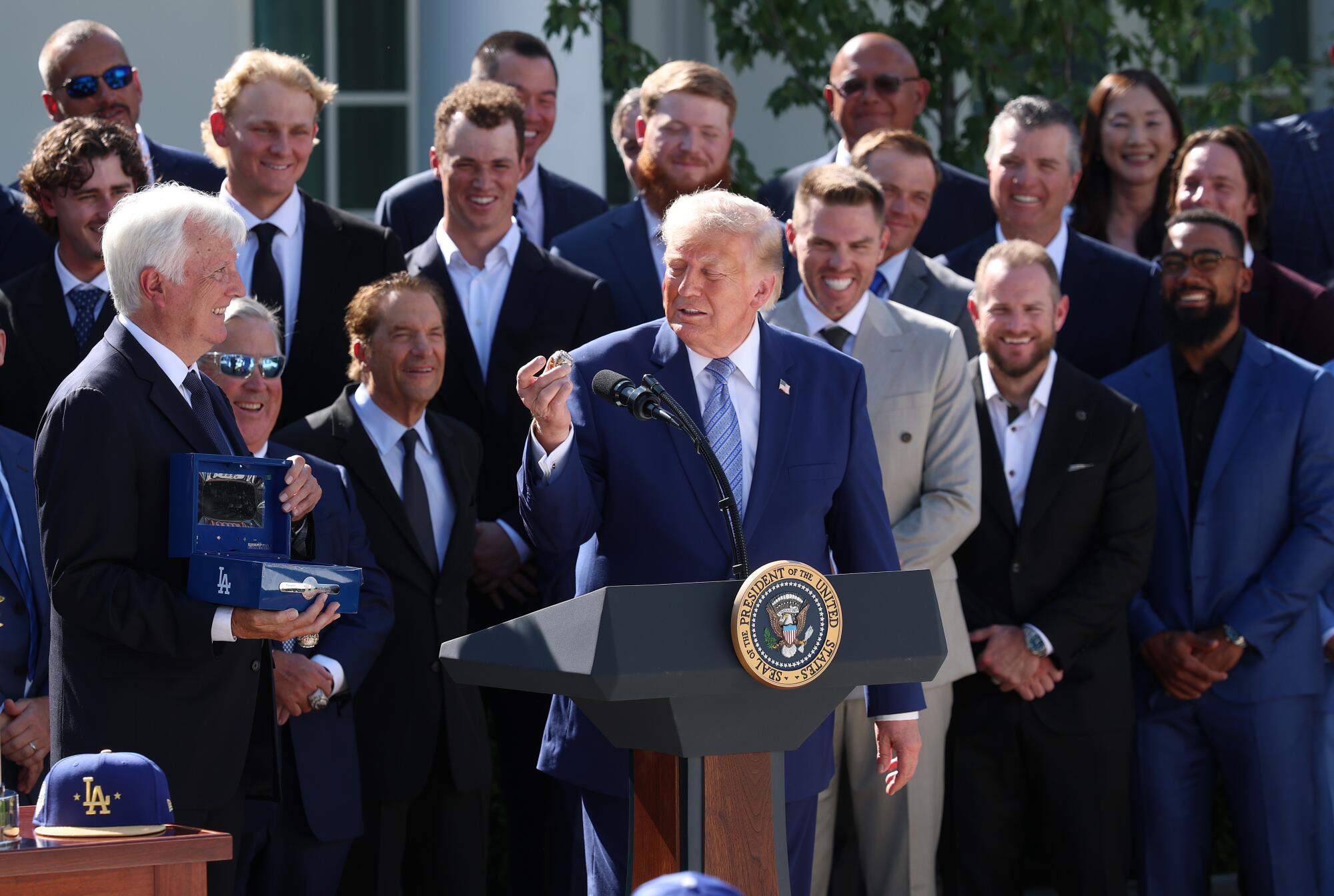 Dodgers chairman Mark Walter presents a 2025 World Series ring to President Trump in the Rose Garden.